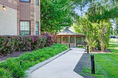 Pathway leading to a gazebo in a landscaped area