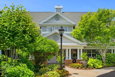 Exterior view of Sunrise of Plymouth Beach with landscaped gardens