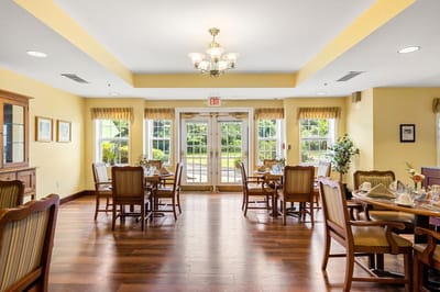 Bright dining room with tables set for meals