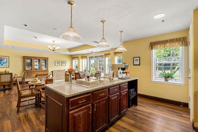 Bright dining area with kitchen and seating