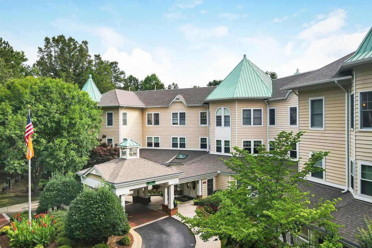 Exterior view of a senior living facility with a green roof