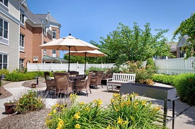 Outdoor seating area with tables and chairs