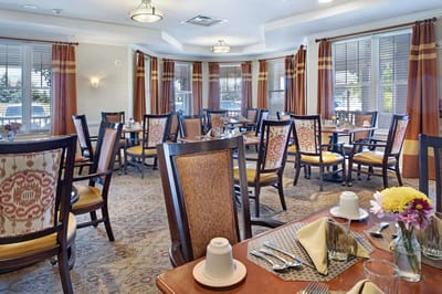 Dining area with tables set for residents