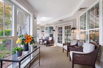 Bright common area with seating and plants