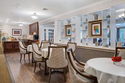 Bright dining area with tables and chairs