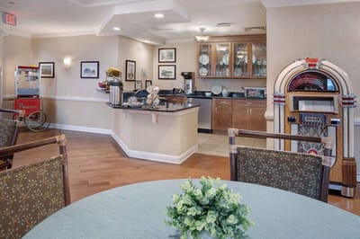 Bright common area with jukebox and coffee station