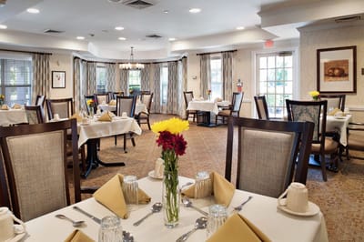Dining room with tables set for a meal