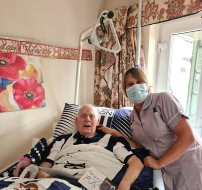A caregiver with a resident in a cozy room
