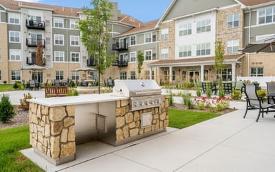 Outdoor barbecue area in a senior living community