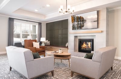 Cozy lounge area with comfortable seating and a fireplace