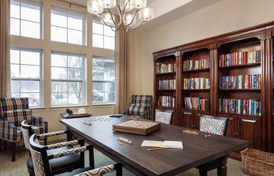 Cozy interior of a common area with bookshelves and seating
