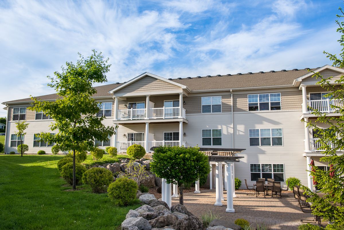 Exterior view of a residential living space with landscaping