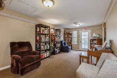 Cozy common area with bookshelves and seating