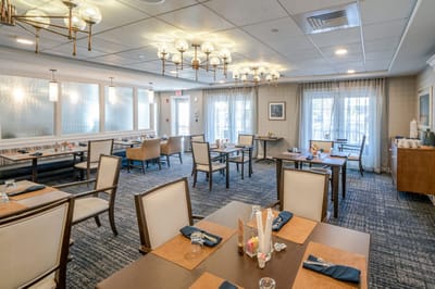 Bright dining room set for meals with tables and chairs