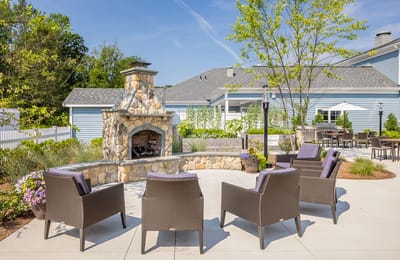 Outdoor seating area with stone fireplace