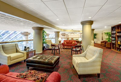 Interior common area with comfortable seating and bookshelves