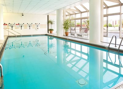 Indoor swimming pool area with natural lighting