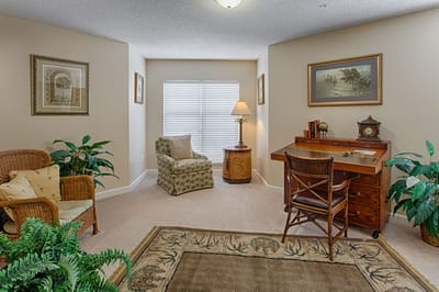 Cozy resident room with desk and seating area