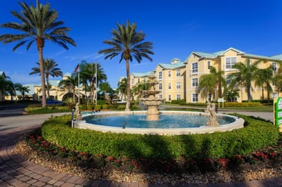 Fountain surrounded by landscaped gardens at the facility entrance