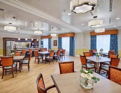 Bright dining room with well-arranged tables and chairs