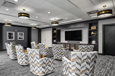 Bright common area with modern seating and decor