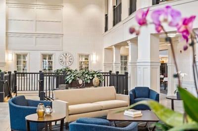 Bright common area with comfortable seating and plants