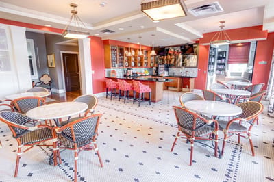 Bright dining area with tables and chairs