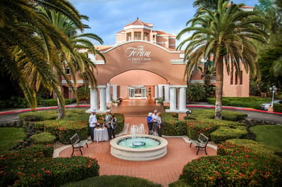 Exterior view of The Forum at Deer Creek with palm trees