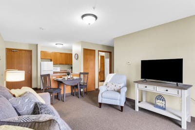 Bright and welcoming resident living area with furniture