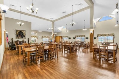 Spacious dining room with wooden tables and chairs