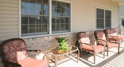 Outdoor patio seating area with flowers