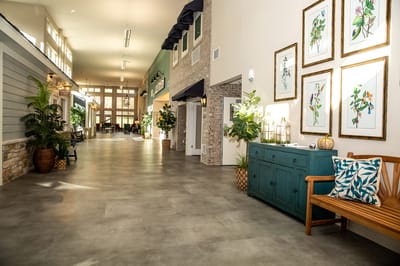 Brightly lit corridor with seating and artwork