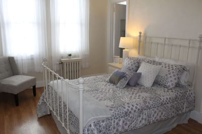 A nicely decorated resident bedroom with natural light