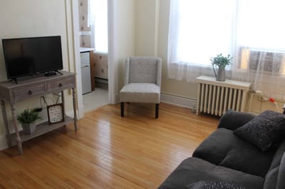 Cozy interior of a resident room with a television and chair