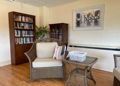 Cozy lounge area with bookshelves and seating