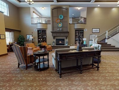 Interior common area with seating and a fireplace
