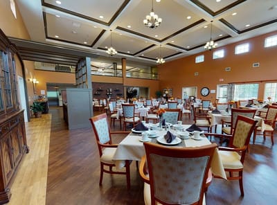 Dining room with tables set for residents
