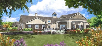 Exterior view of a senior living facility surrounded by gardens