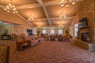 Interior of a cozy lounge area with seating and fireplace