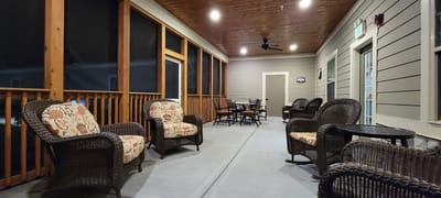 Covered outdoor seating area with wicker chairs