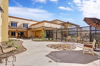 Outdoor patio area with seating and landscaping