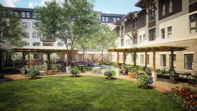 Beautifully landscaped courtyard with seating and flowers