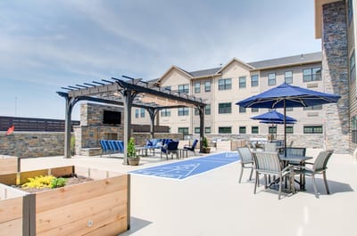 Outdoor patio area with seating and umbrellas