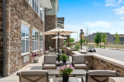 Outdoor seating area with tables and umbrellas