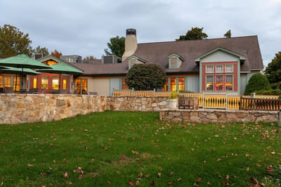 Exterior view of a senior living facility with landscaped grounds