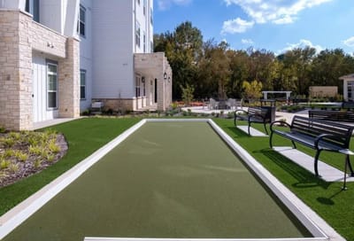 Outdoor bocce ball court with benches