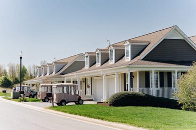 Exterior view of senior living units with golf carts