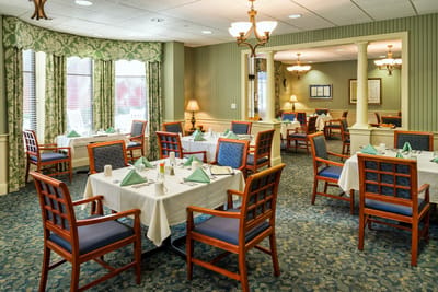 Elegant dining room setup with tables and chairs