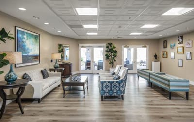 Bright and inviting common area with seating and artwork