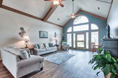 Interior lounge area with seating and large windows